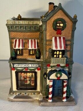 Christmas Shop Store village building with illuminated window.